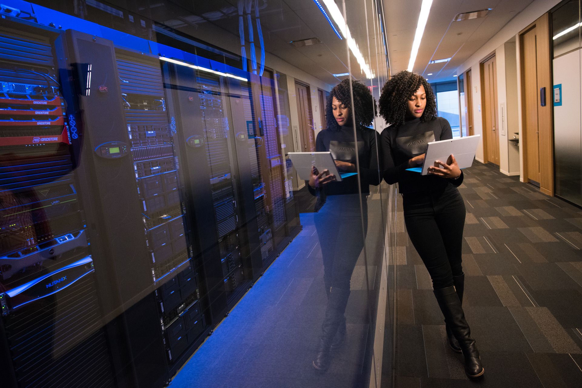 Engineers walking a data center corridor
